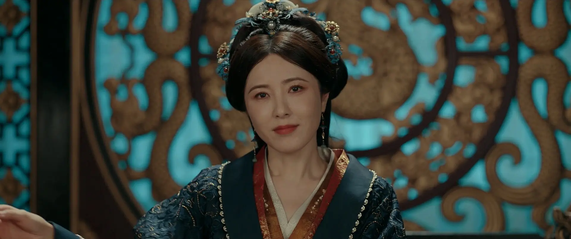 Consort Rong smiling coldly as she plans another scheme