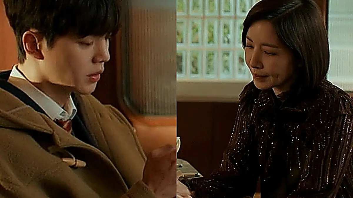 Kang Bi-o having a tense conversation with his mother Ji-hye across the table