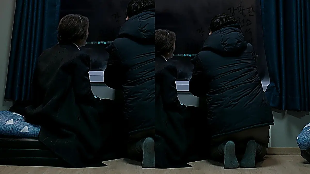 Dong-seok writes their family names on the steamed ferry window