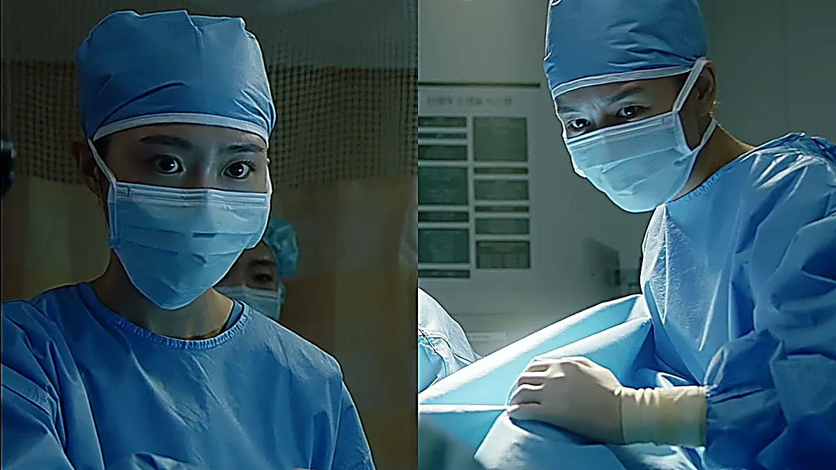 Two medical practitioners wearing blue surgical scrub caps and protective face masks.