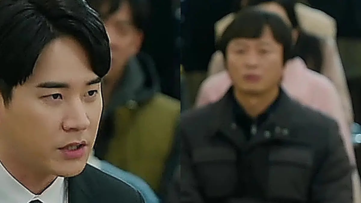 Kim Yang-ki presenting courtroom evidence while wearing a dark formal suit and necktie