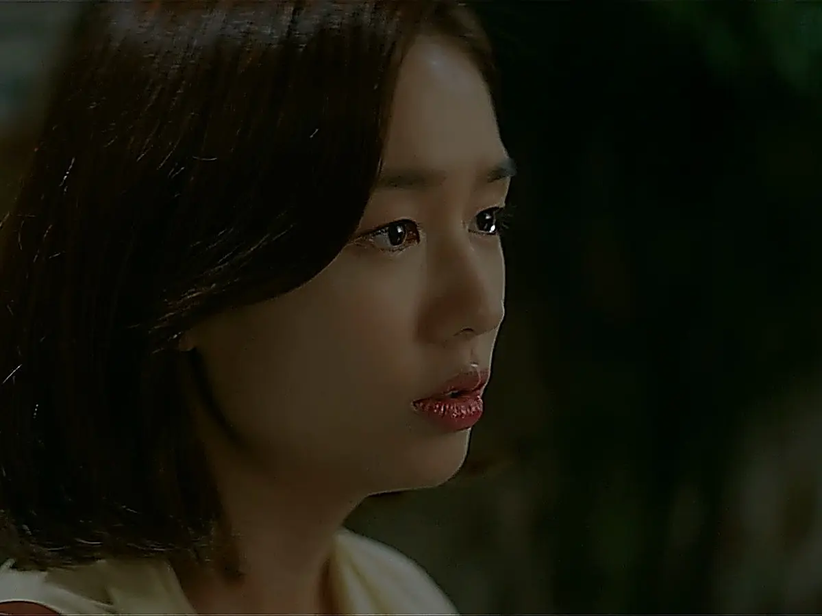 Chu Min-ha in a clean off-white collared button-down top