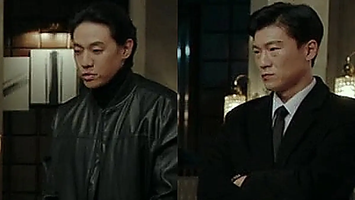 Family members gathered in tailored suits, double-breasted blazers, and knitwear