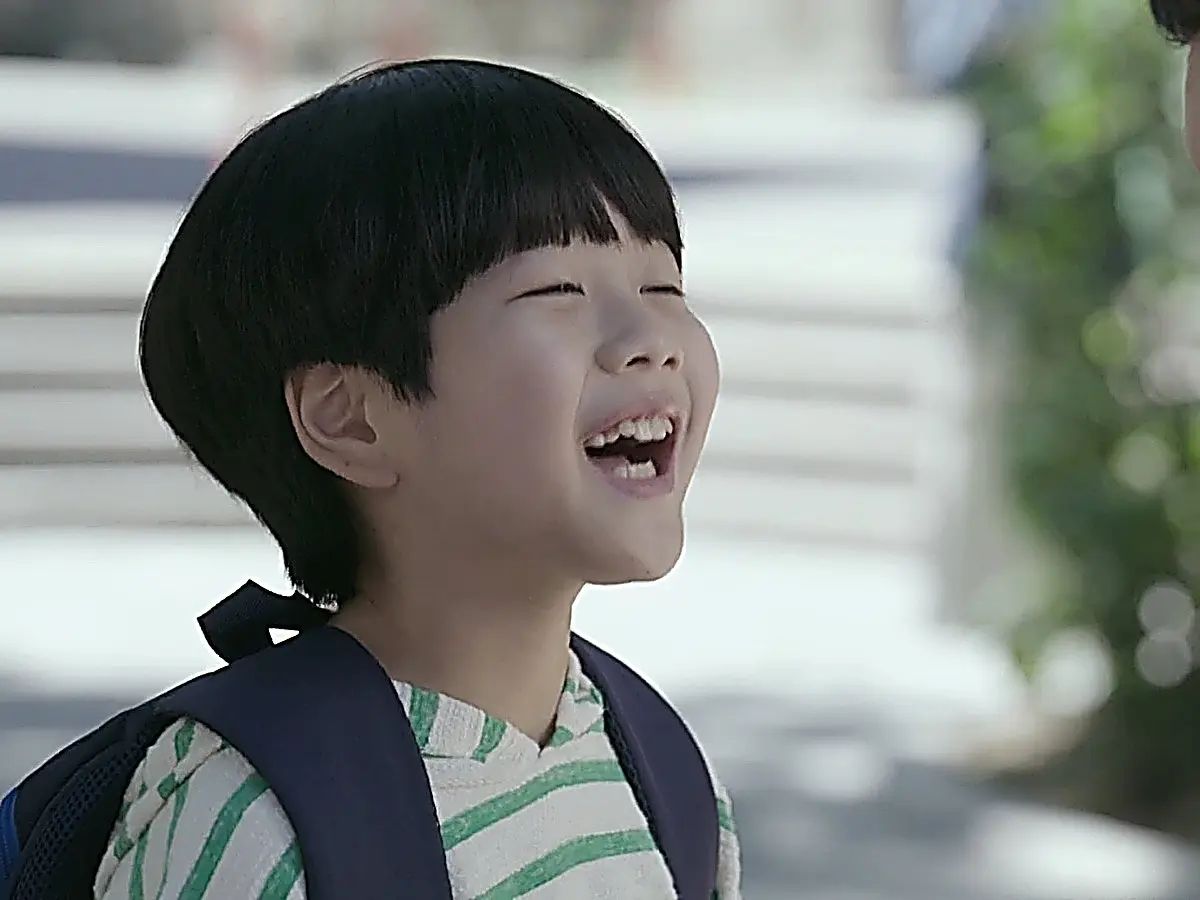 Han-gyeol smiling while speaking about his mother