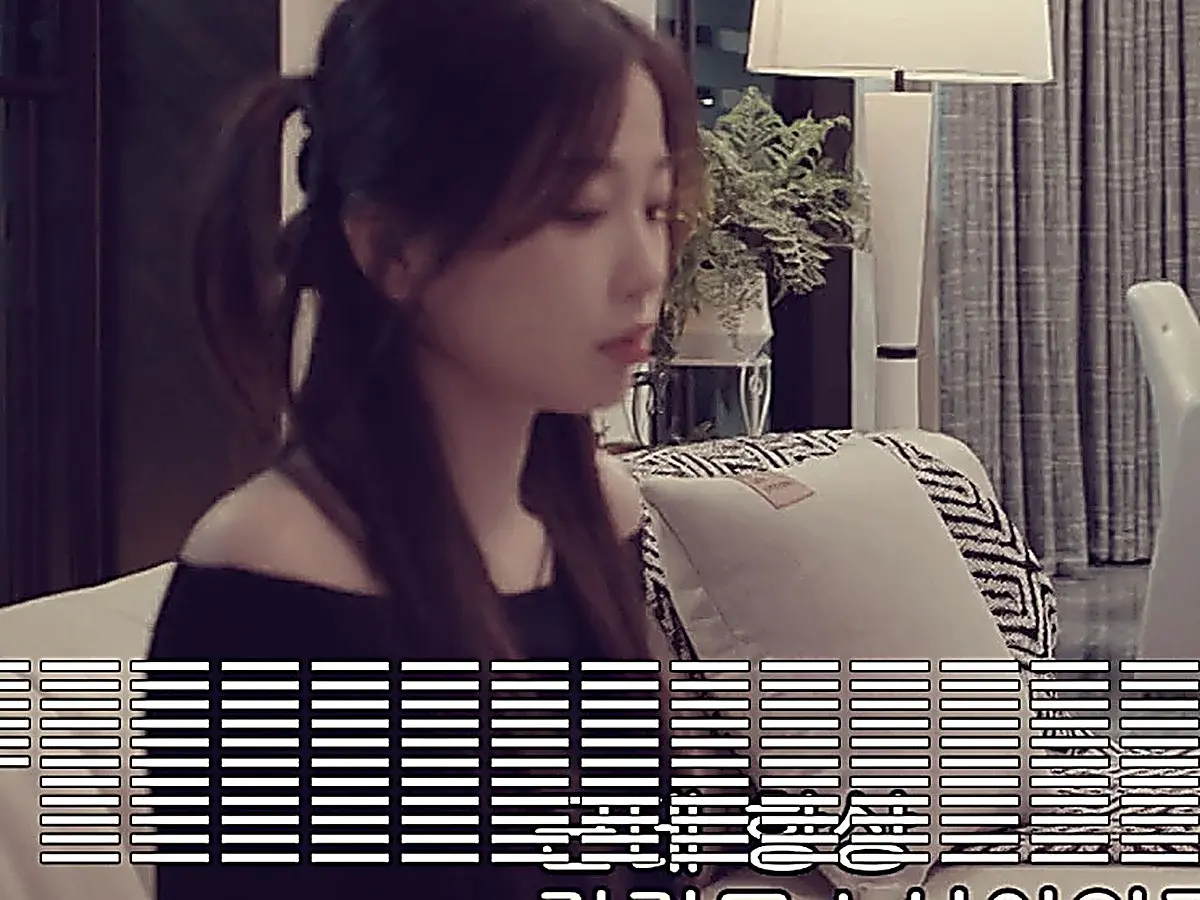 Jiang Mu wearing a black off-shoulder top as Jin Zhao approaches in a knit cardigan