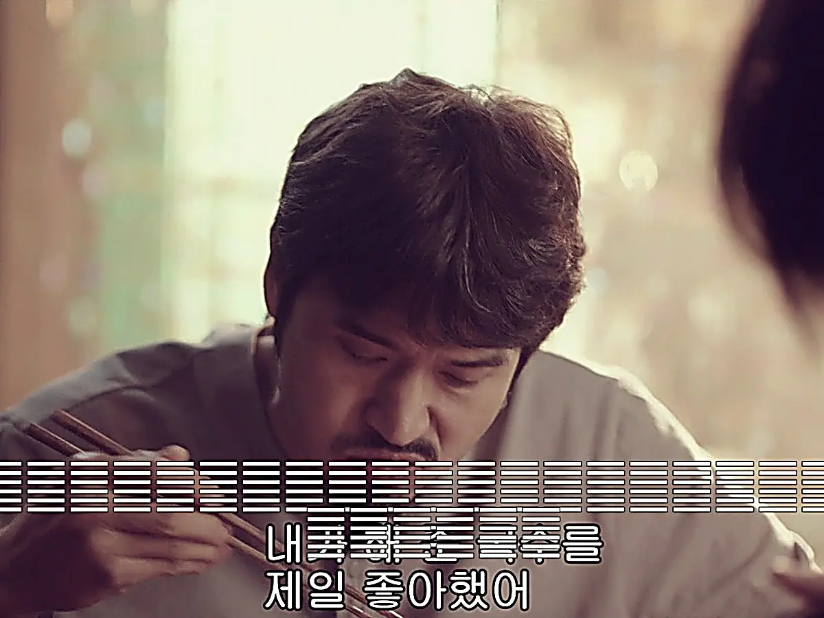 Jin Zhao reflecting over a warm bowl of Yangchun noodles prepared by his father
