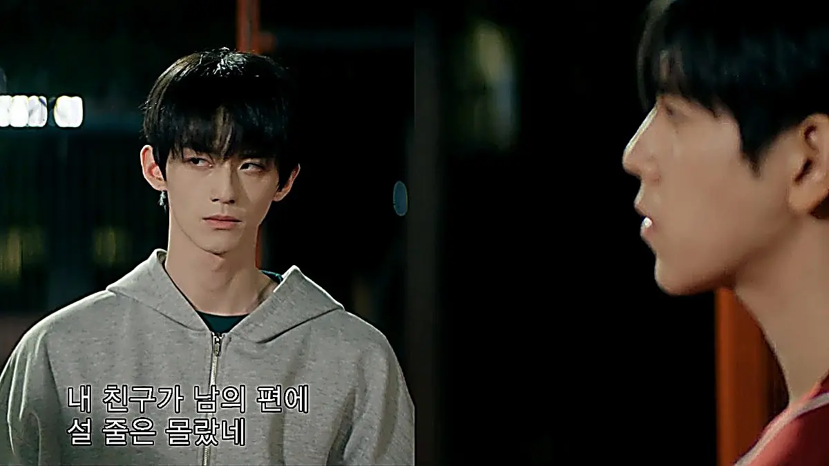 Shen Fuxian wearing a heather grey zip-front hoodie over a forest green crewneck shirt