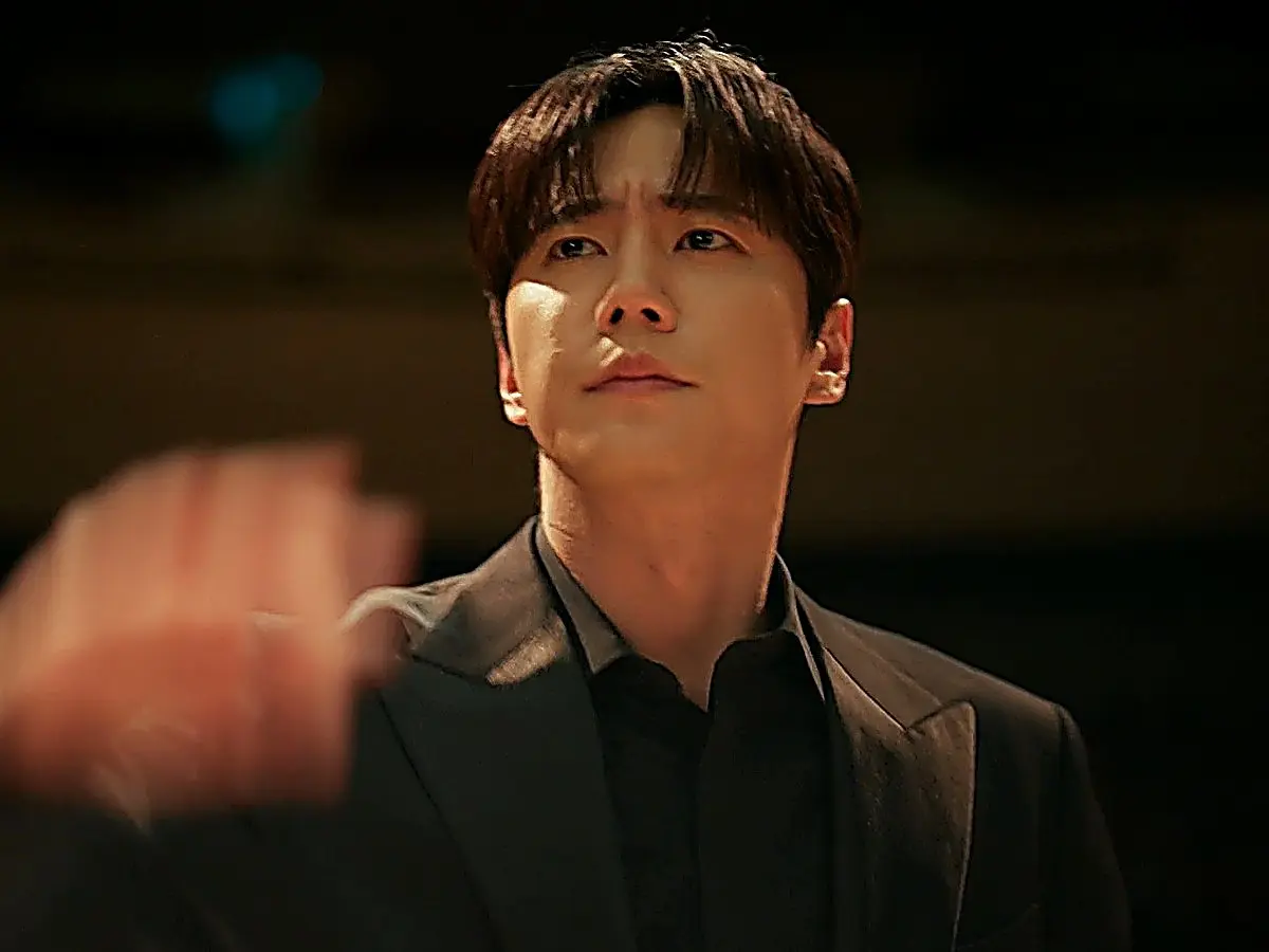 Choi Jeong-yo commands the stage as an orchestra conductor