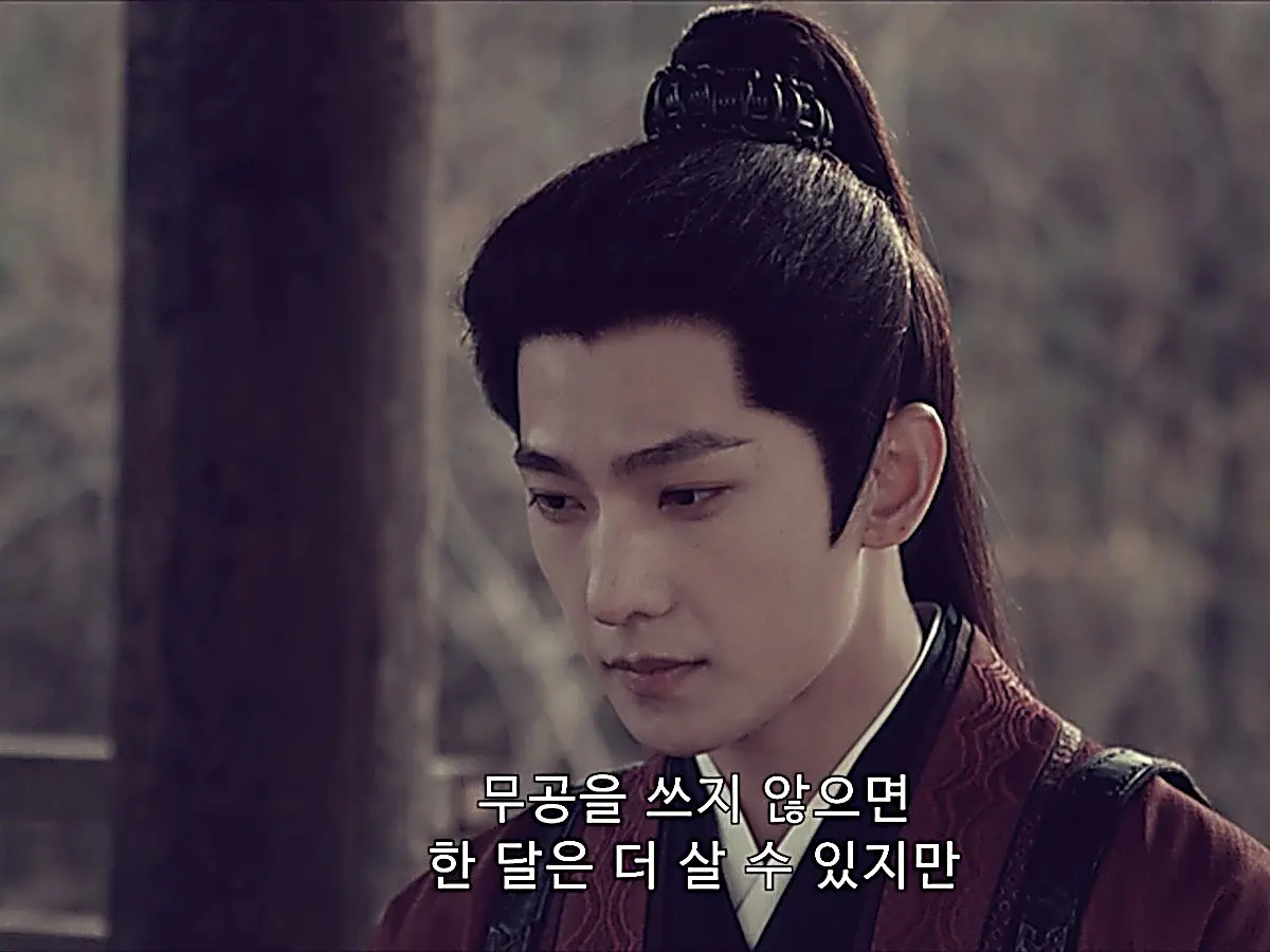 Zhan Zhao listening to Bai Yutang while wearing his structured crimson robe