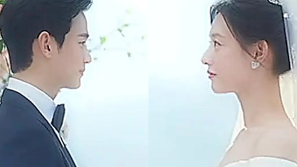 Baek Hyun-woo and Hong Hae-in standing before a flower arch during their lavish wedding ceremony