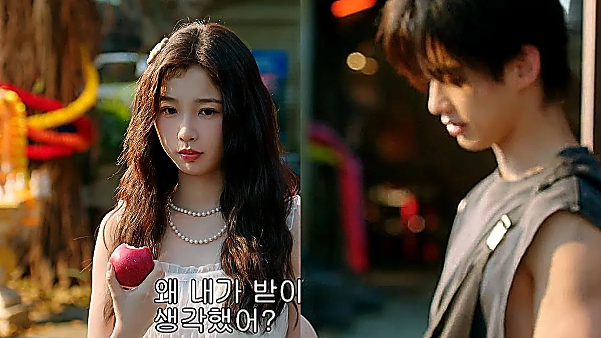Jiang Mu in a white ruffled sundress with pearl necklaces offering an apple to Jin Zhao in a sleeveless charcoal tank