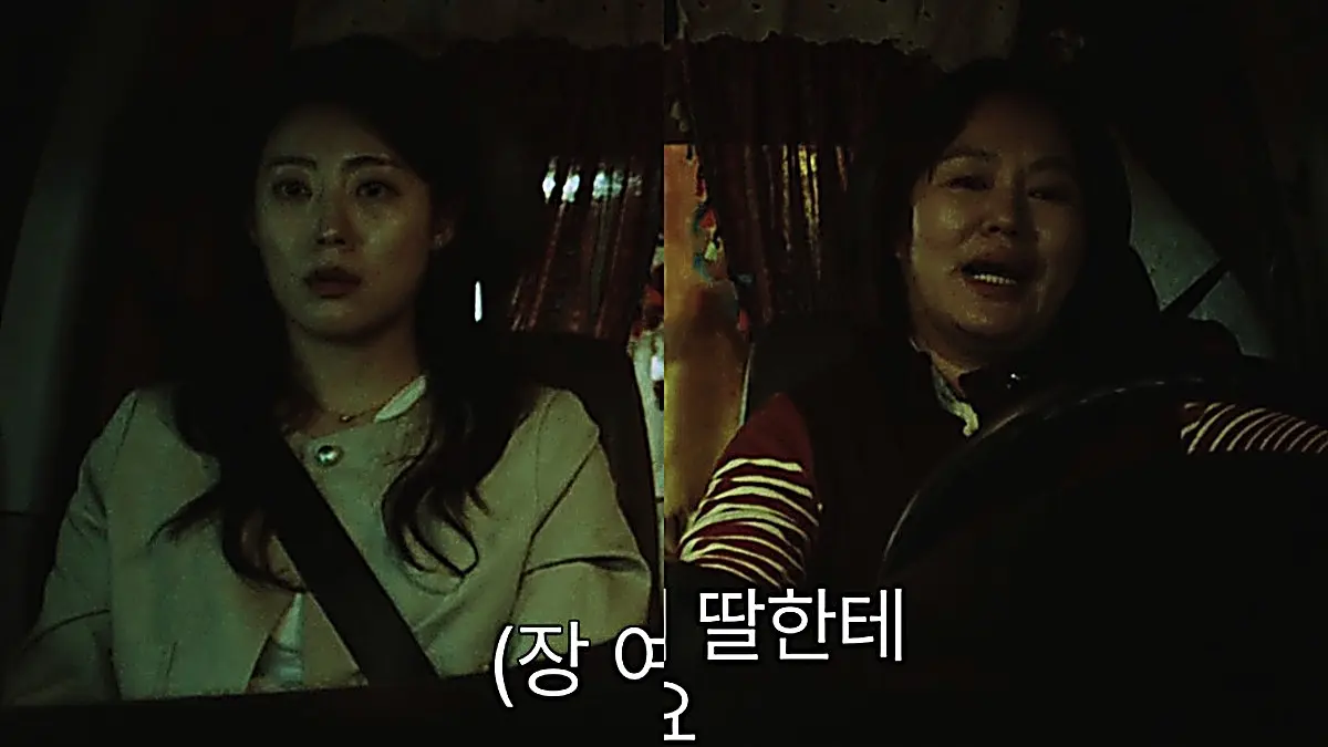 Mrs. Jang speaking with pride behind the steering wheel