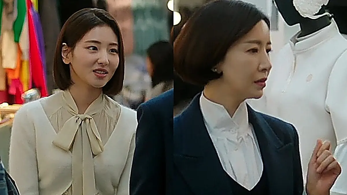 Lee Ji-hye in a cream cardigan and bow blouse alongside Martina in a navy blazer at Dongdaemun Market