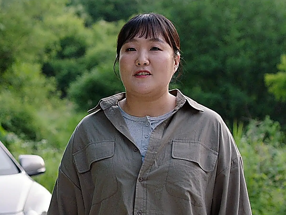 Staff Sergeant Park Min-ju in an olive-drab collared button-down utility shirt