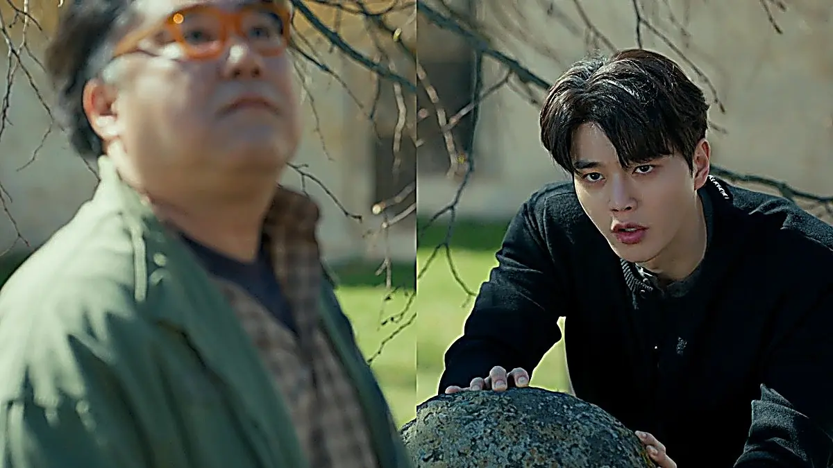 Bi-o outdoors wearing a black buttoned cardigan layered over a collared shirt