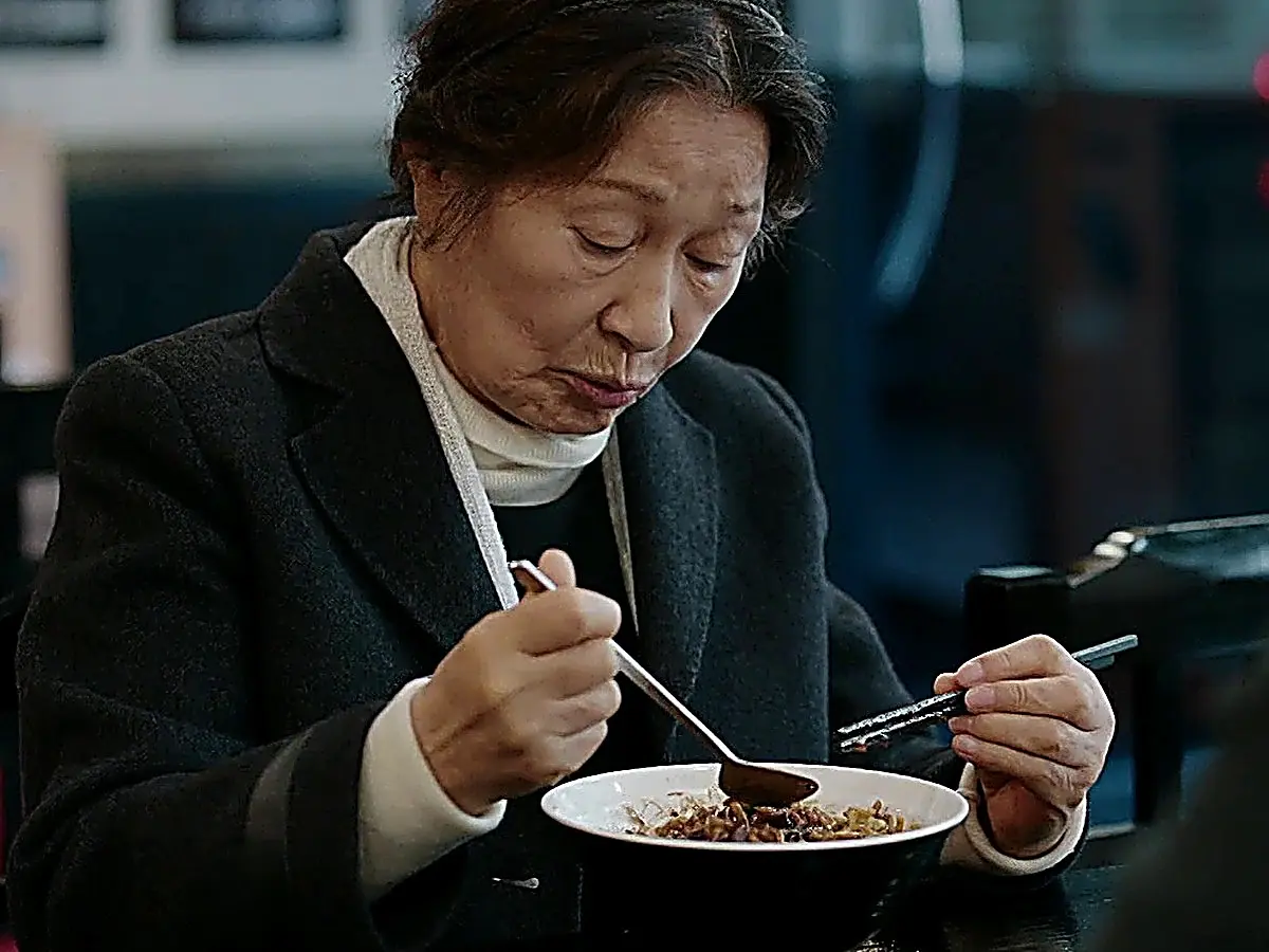 Ok-dong quietly finishes a warm meal at a local diner