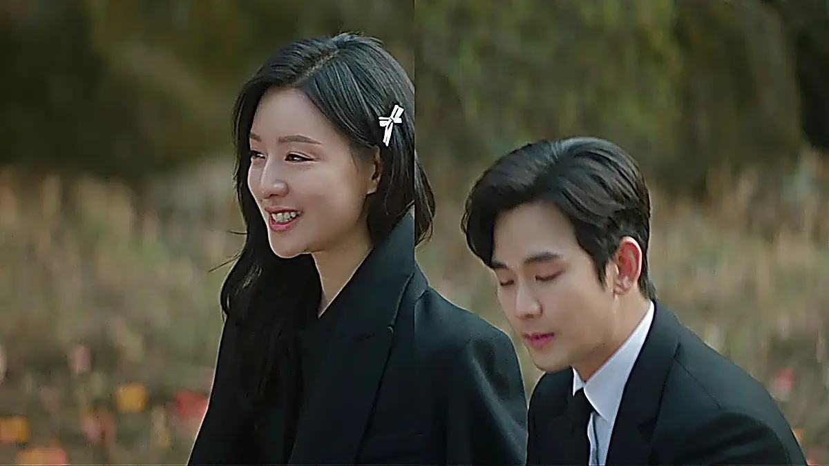 Hong Hae-in wearing an oversized structured black tailored blazer with a silver ribbon hairpin accent
