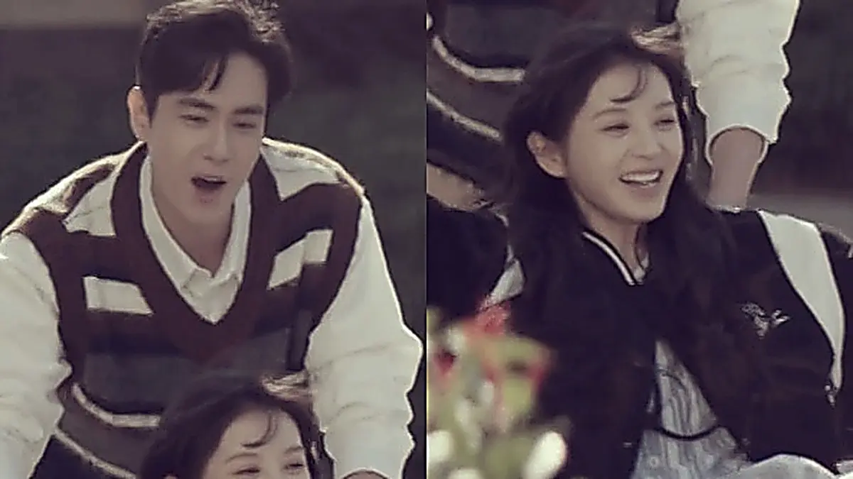 Lin Zhixia and Zhang Yubai smiling outdoors as he pushes her wheelchair