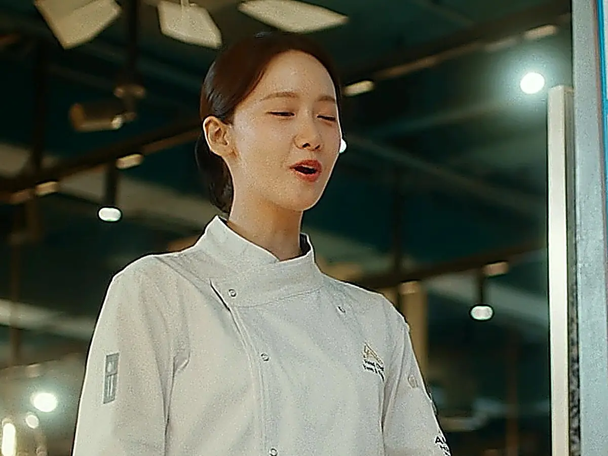 Yeon Ji-young in a crisp white double-breasted chef coat with stand collar