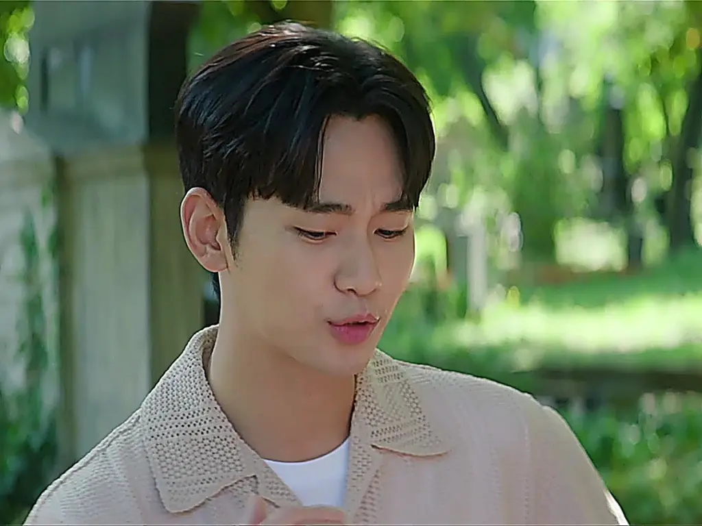 Baek Hyun-woo wearing a beige textured open-collar knit polo over a white undershirt
