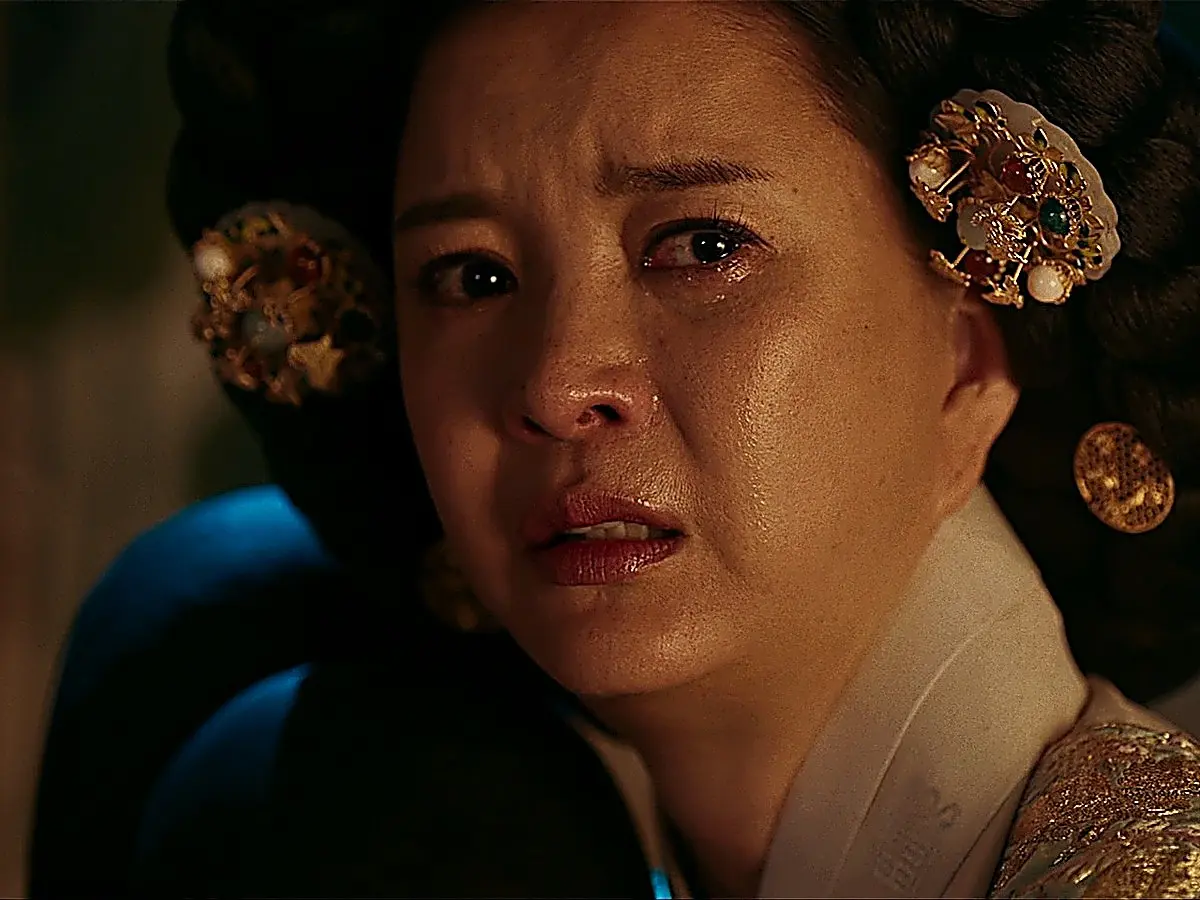 Queen Dowager Jahyeon wearing ornate floral pearl hairpins and gemstone hair ornaments with a gold-embroidered court robe