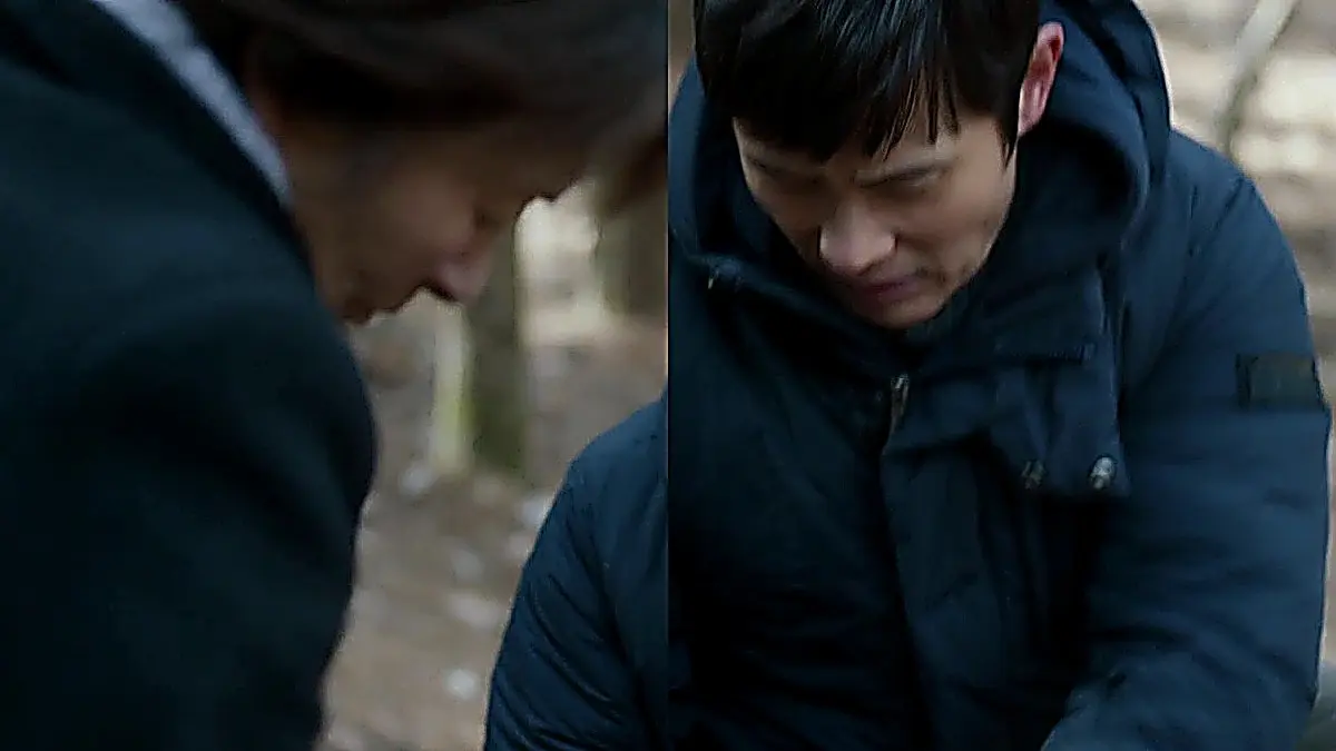Dong-seok checks on Ok-dong's ankle after she slips on the path