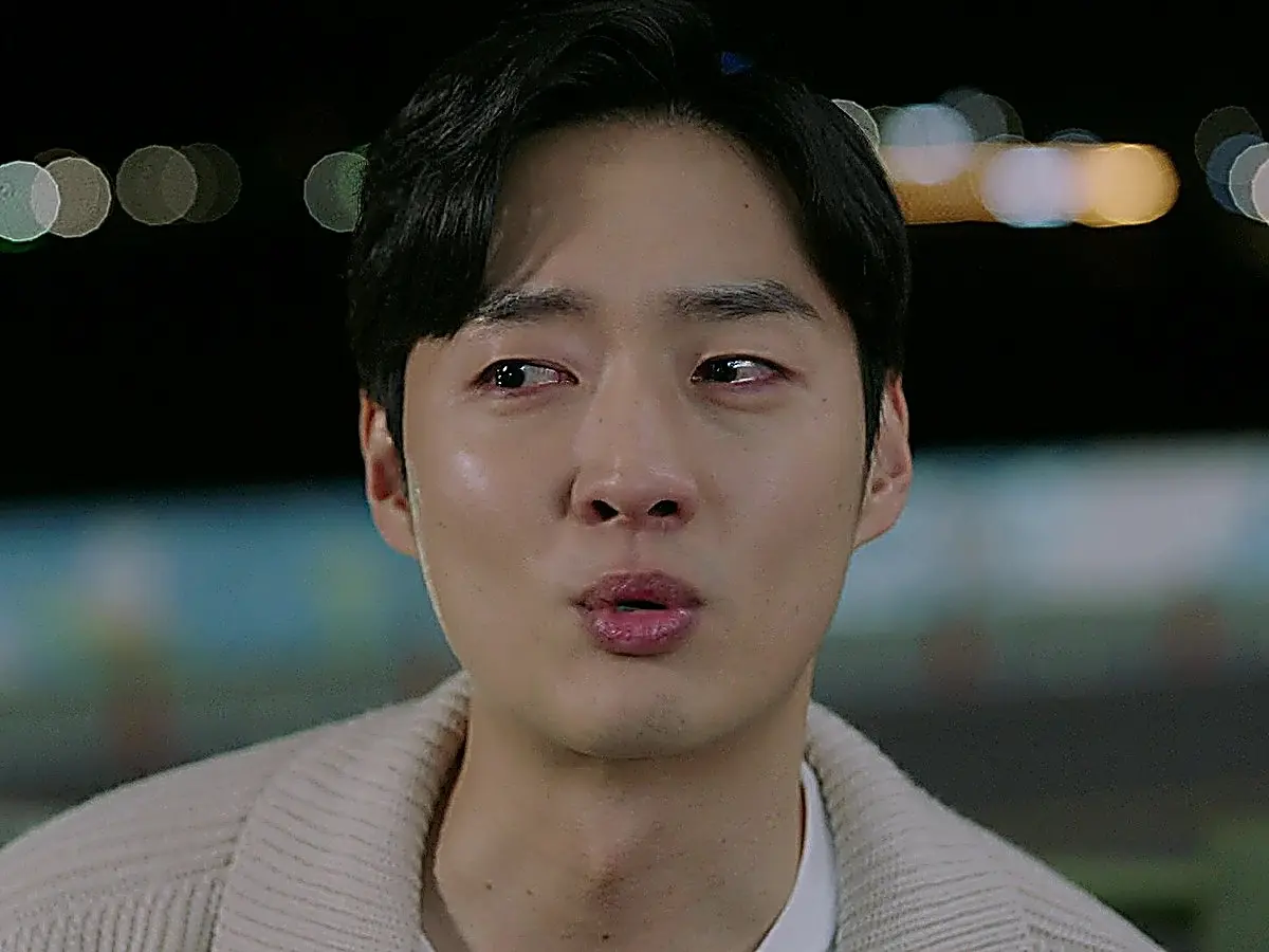 Bu Sang-do in a ribbed knit polo collar sweater over a white crewneck shirt