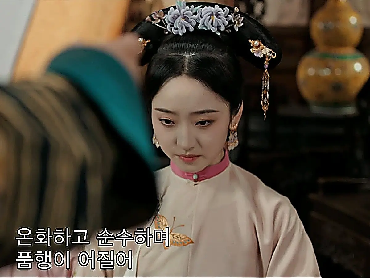 Shen Chujie receiving her promotion decree in pale rose robe with butterfly embroidery