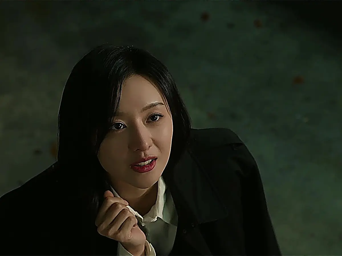 Hong Hae-in wearing a tailored black outer blazer over a sharp white collared shirt at night